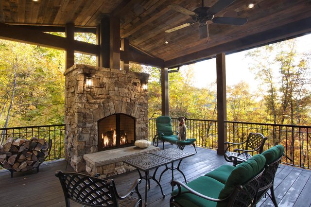 Cliff Haven outdoor fireplace and seating on covered porch